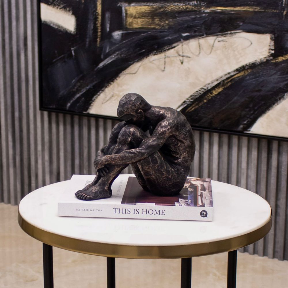 Escultura de Hombre Sentado